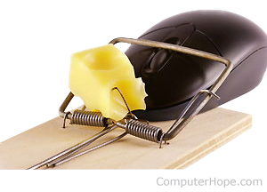 Computer mouse trapped in a mouse trap with cheese.