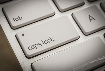 Computer keyboard caps lock key with LED indicator light.